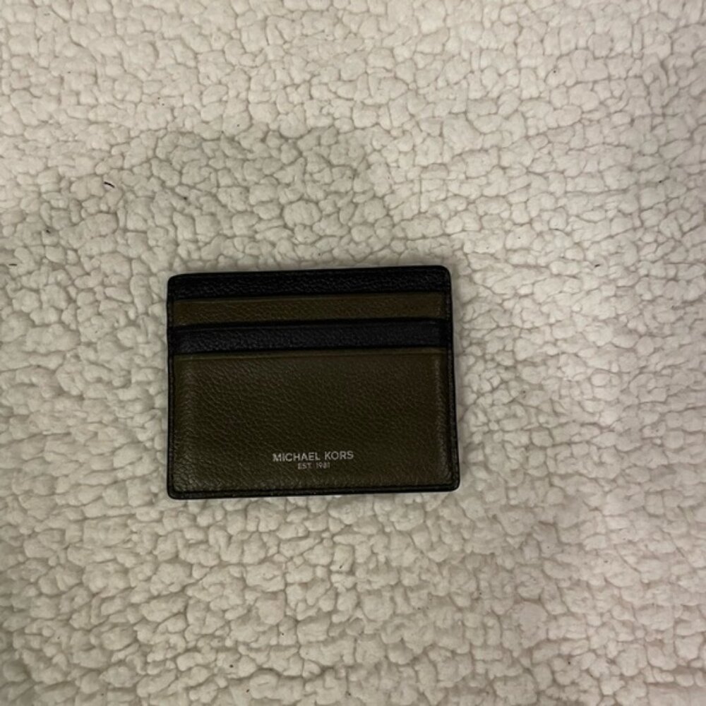Michael Kors green and black card holder. Holds 7 cards.